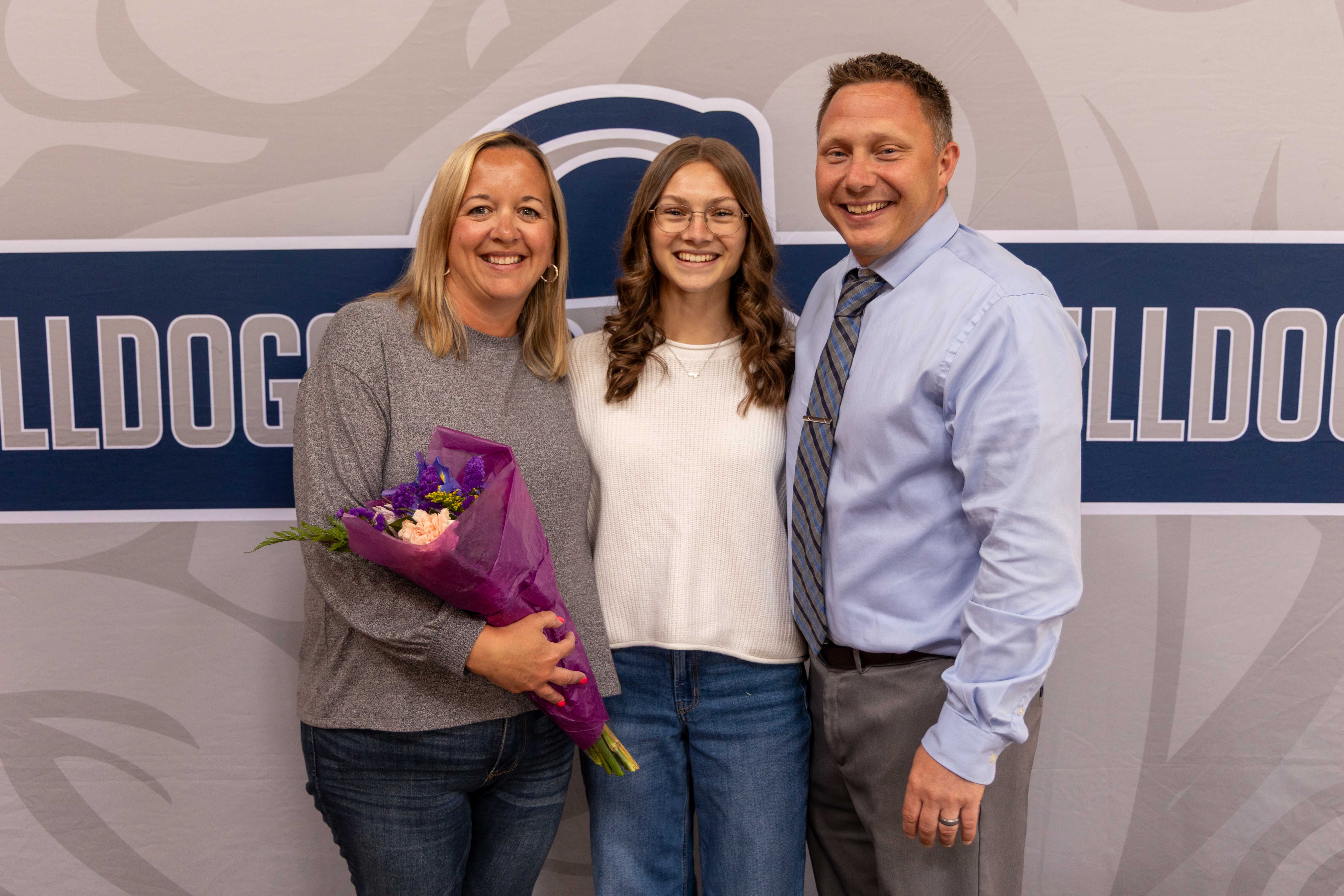 Ava Yorke poses with her parents, Lisa and Tom